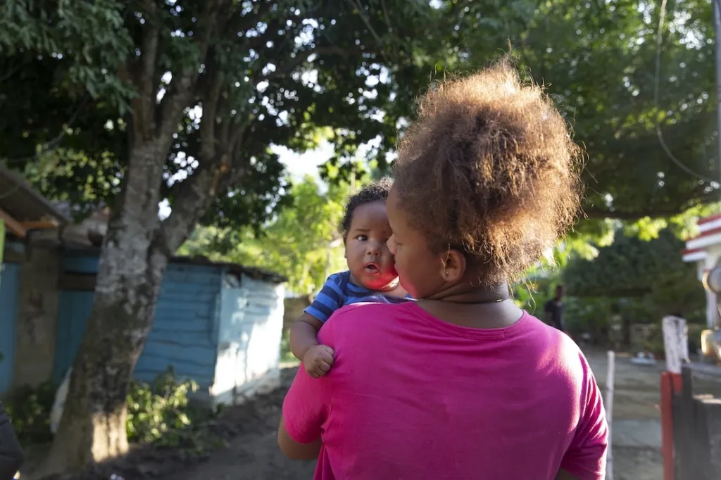 woman holding small child